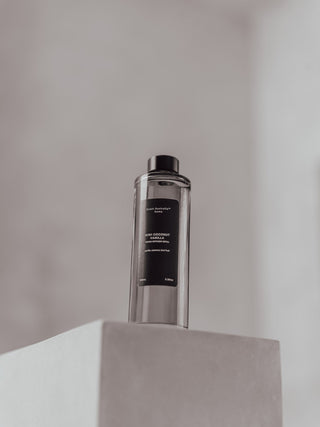 kirri reed diffuser refill bottle on a white plinth