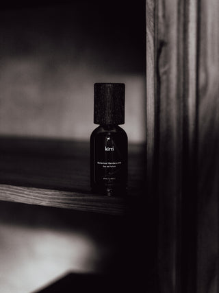 kirri fragrance bottle on a dark timber shelf