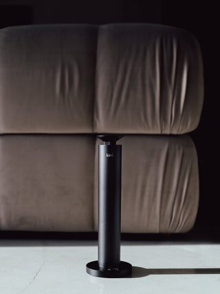 kirri pillar diffuser in front of a sofa