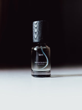 kirri eau de parfum bottle against a dark background