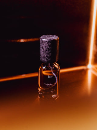 kirri fragrance oil lit by warm amber light