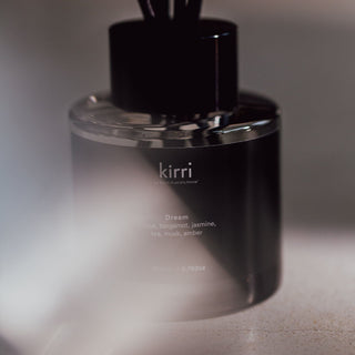 close up of a kirri dream reed diffuser with black reeds