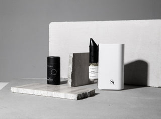 Fragrance oil bottles beside a kirri diffuser